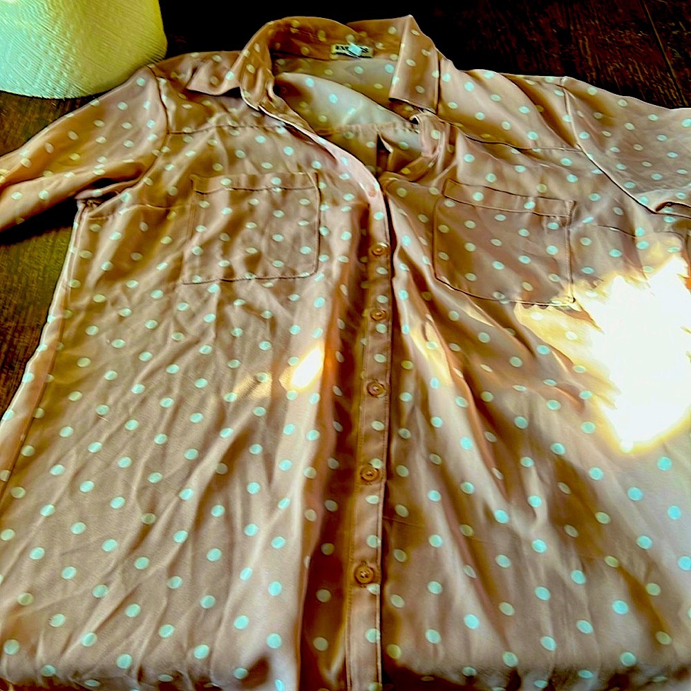 Pink blouse, white polkadots, polyester, hundred percent washing machine,cold
